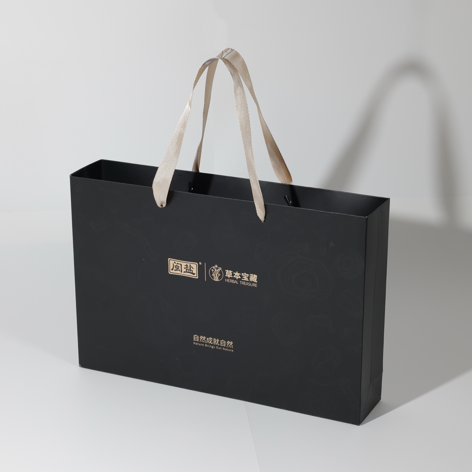 Fujian Salt 闽盐 × Herbal Treasure — black luxury paper bag with gold foil and herringbone ribbon handles