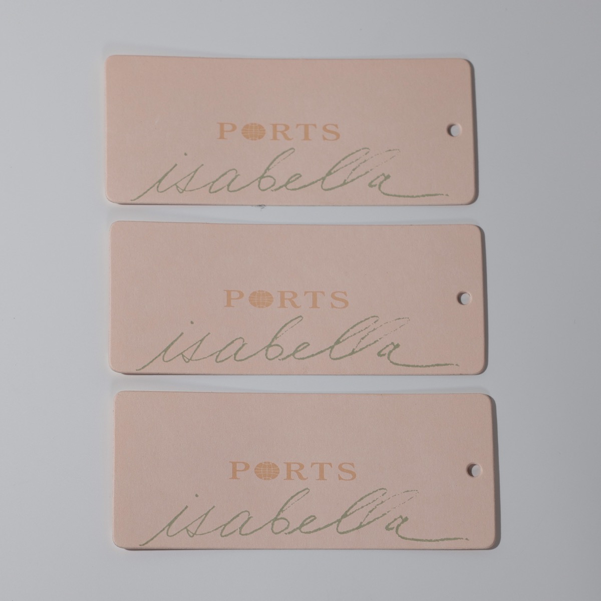 PORTS isabella — blush fashion hang tags with two-color script print on uncoated stock